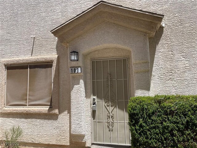 9333 Leaping Deer Pl Unit 103, Las Vegas, NV 89178 - entrance to property featuring stucco siding