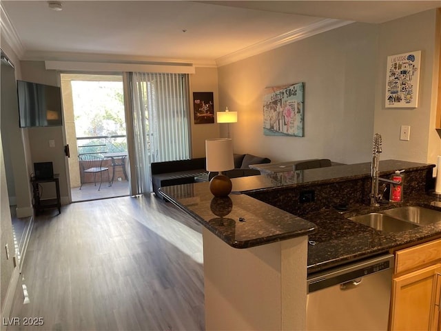 260 E Flamingo Rd Unit 228, Las Vegas, NV 89169 - kitchen with stainless steel dishwasher, a sink, dark stone countertops, crown molding, and light wood-style flooring