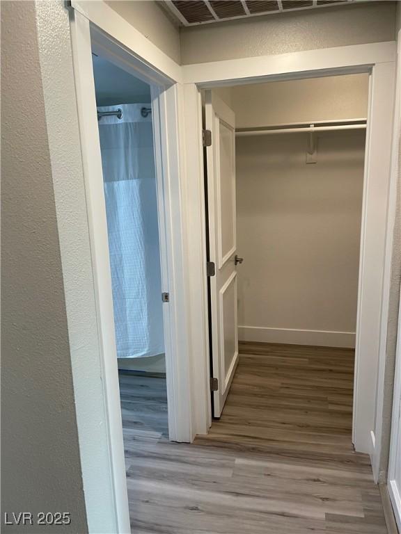 260 E Flamingo Rd Unit 228, Las Vegas, NV 89169 - hallway with wood finished floors and baseboards