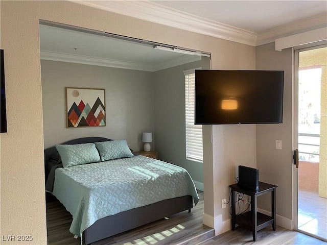 260 E Flamingo Rd Unit 228, Las Vegas, NV 89169 - bedroom with crown molding, wood finished floors, and multiple windows