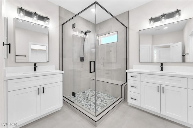10345 Howling Coyote Ave, Las Vegas, NV 89135 - bathroom featuring a stall shower and two vanities