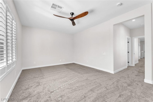 10345 Howling Coyote Ave, Las Vegas, NV 89135 - carpeted empty room with ceiling fan, plenty of natural light, a smoke detector, and baseboards