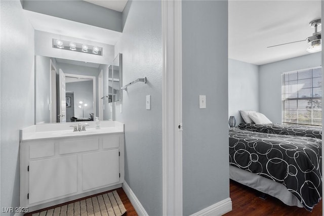 231 W Horizon Ridge Parkway Unit 1228, Henderson, NV 89012 - bathroom with wood finished floors, ceiling fan, vanity, and baseboards