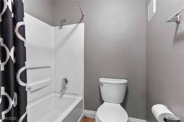 231 W Horizon Ridge Parkway Unit 1228, Henderson, NV 89012 - bathroom featuring shower / tub combo with curtain, baseboards, and toilet