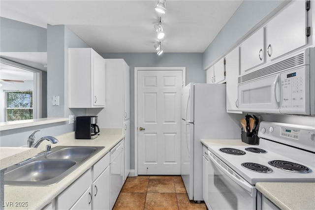 231 W Horizon Ridge Parkway Unit 1228, Henderson, NV 89012 - kitchen with white appliances, a sink, light countertops, white cabinets, and tile patterned floors