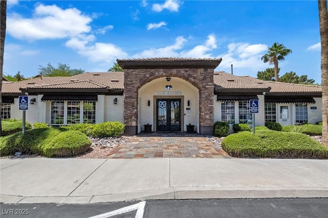 231 W Horizon Ridge Parkway Unit 1228, Henderson, NV 89012 - entrance to property featuring french doors, a tile roof, and stucco siding