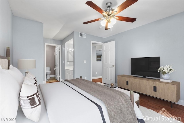 231 W Horizon Ridge Parkway Unit 1228, Henderson, NV 89012 - bedroom featuring wood finished floors, baseboards, connected bathroom, and a ceiling fan