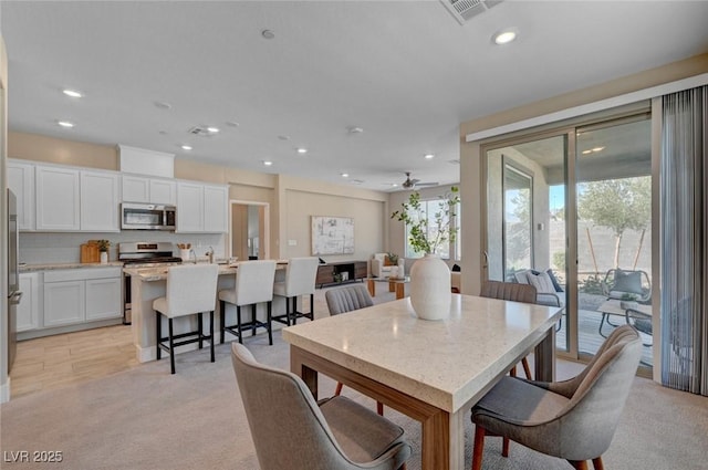 9903 Spinel Pl, Las Vegas, NV 89143 - dining area with recessed lighting, light carpet, and a ceiling fan
