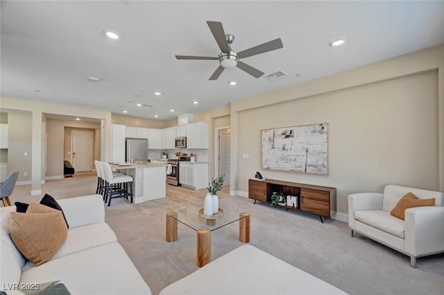 9903 Spinel Pl, Las Vegas, NV 89143 - living area featuring ceiling fan, light carpet, recessed lighting, and baseboards
