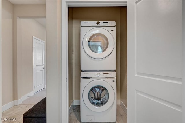9903 Spinel Pl, Las Vegas, NV 89143 - laundry area featuring stacked washer / dryer and baseboards