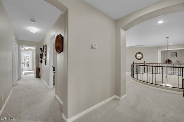 9046 Barium Rock Ave, Las Vegas, NV 89143 - hall featuring carpet flooring, baseboards, and arched walkways