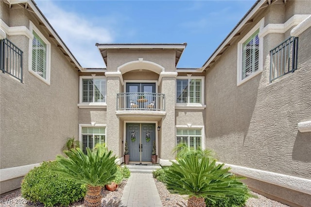 9046 Barium Rock Ave, Las Vegas, NV 89143 - entrance to property featuring a balcony and stucco siding