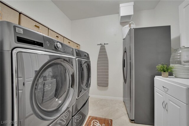 9046 Barium Rock Ave, Las Vegas, NV 89143 - clothes washing area featuring washing machine and dryer, baseboards, and cabinet space