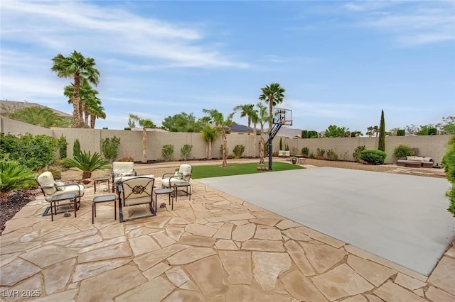 9046 Barium Rock Ave, Las Vegas, NV 89143 - view of patio / terrace featuring a fenced backyard