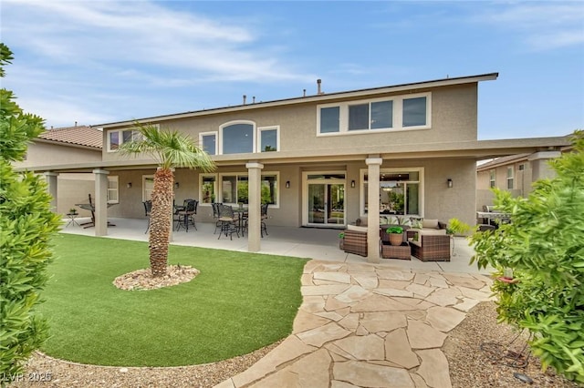 9046 Barium Rock Ave, Las Vegas, NV 89143 - back of property featuring stucco siding, a patio, and an outdoor hangout area