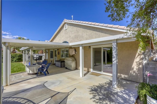 6021 Winter Meadow St, Las Vegas, NV 89130 - back of property with stucco siding and a patio area