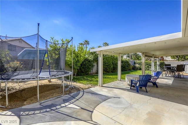 6021 Winter Meadow St, Las Vegas, NV 89130 - view of patio featuring a trampoline and outdoor dining space