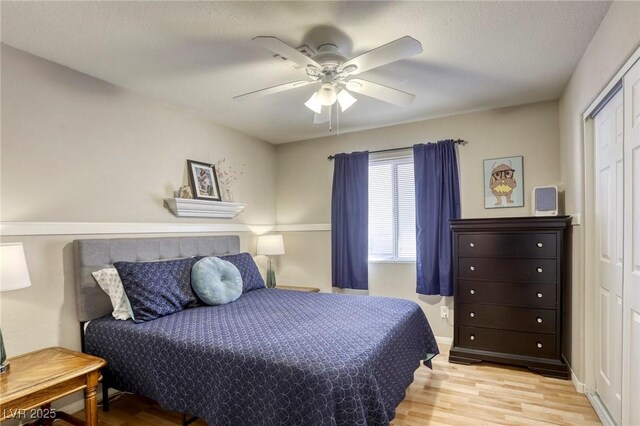 6021 Winter Meadow St, Las Vegas, NV 89130 - bedroom with wood finished floors, a closet, and a ceiling fan