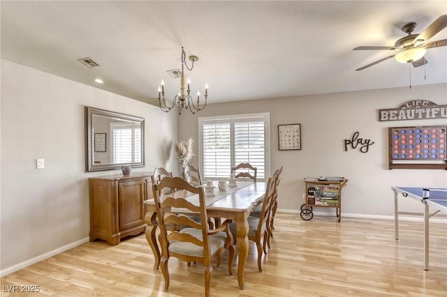 6021 Winter Meadow St, Las Vegas, NV 89130 - dining room featuring light wood-style floors, baseboards, a chandelier, and a ceiling fan
