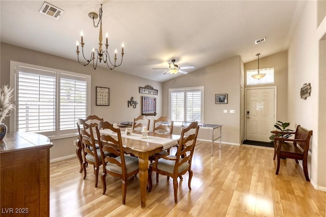 6021 Winter Meadow St, Las Vegas, NV 89130 - dining space featuring lofted ceiling, light wood finished floors, baseboards, a ceiling fan, and a chandelier