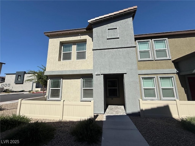 1906 Arietta Vista St, Henderson, NV 89044 - view of front of house with stucco siding and fence