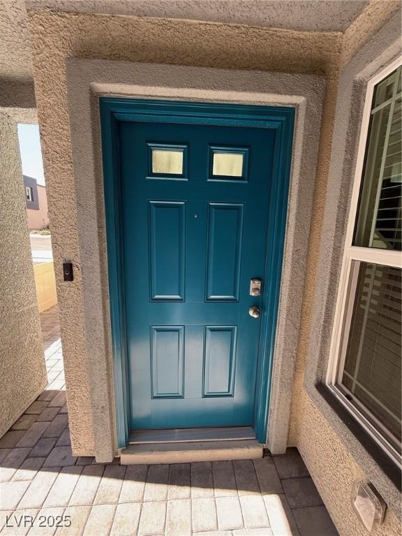 1906 Arietta Vista St, Henderson, NV 89044 - doorway to property featuring stucco siding