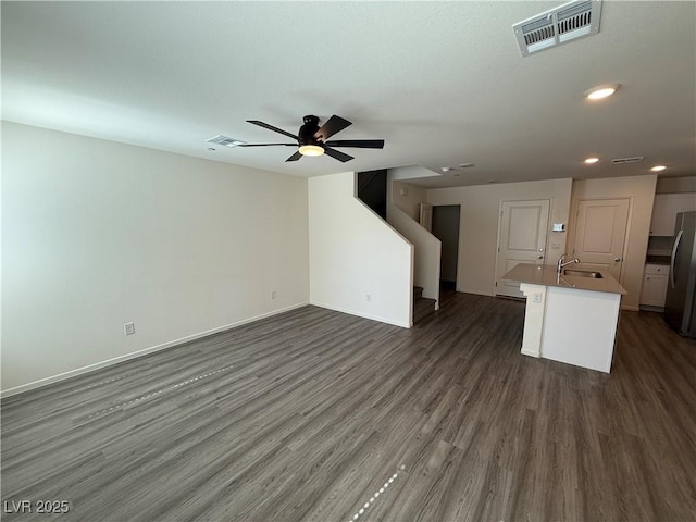 1906 Arietta Vista St, Henderson, NV 89044 - unfurnished living room with a sink, dark wood-style flooring, ceiling fan, recessed lighting, and baseboards