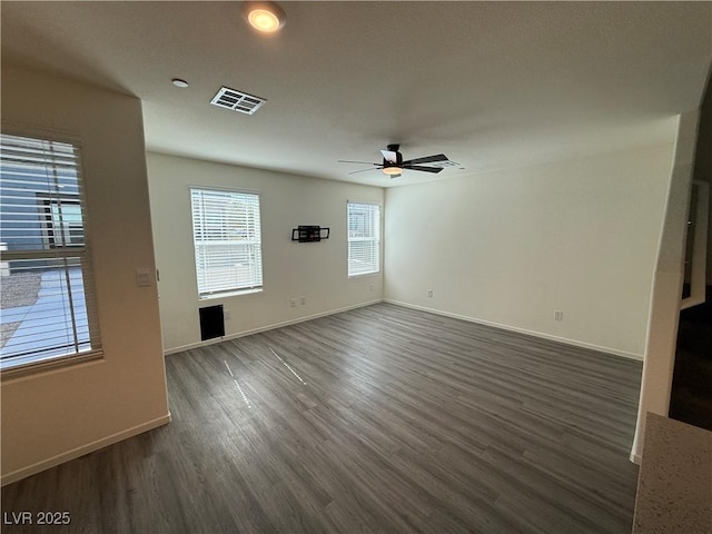 1906 Arietta Vista St, Henderson, NV 89044 - spare room with ceiling fan, dark wood-style flooring, and baseboards