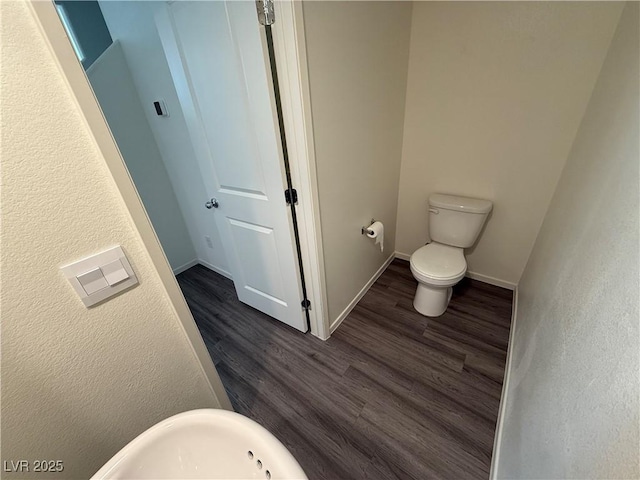 1906 Arietta Vista St, Henderson, NV 89044 - bathroom featuring wood finished floors, toilet, baseboards, and a sink