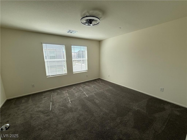 1906 Arietta Vista St, Henderson, NV 89044 - spare room featuring dark colored carpet and baseboards