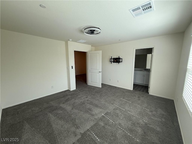 1906 Arietta Vista St, Henderson, NV 89044 - unfurnished bedroom featuring dark carpet and baseboards