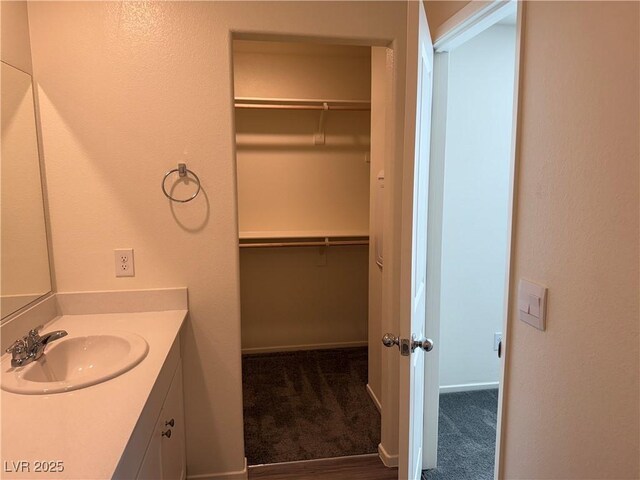 1906 Arietta Vista St, Henderson, NV 89044 - bathroom featuring vanity and a walk in closet