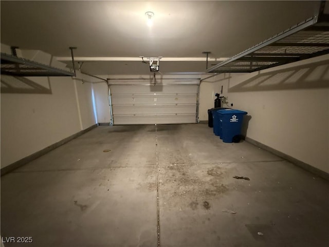 1906 Arietta Vista St, Henderson, NV 89044 - garage with baseboards and a garage door opener