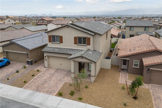 2729 Pavehawk Way, Las Vegas, NV 89156 - view of front of home with a residential view, stucco siding, decorative driveway, and a tiled roof