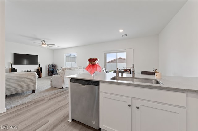 2729 Pavehawk Way, Las Vegas, NV 89156 - kitchen featuring dishwasher, white cabinetry, a ceiling fan, light wood finished floors, and light stone counters