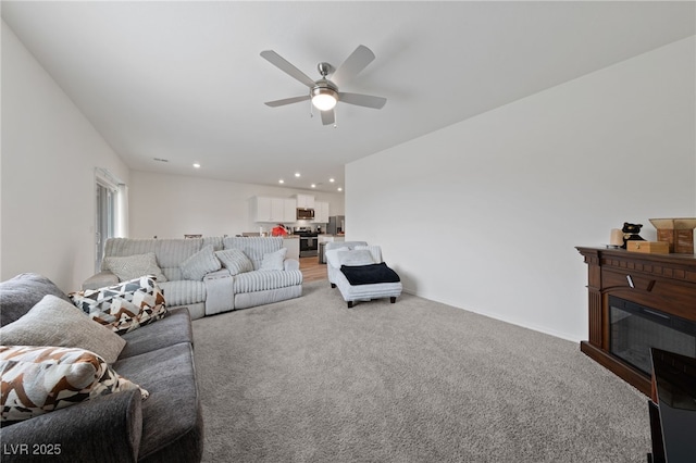 2729 Pavehawk Way, Las Vegas, NV 89156 - living room featuring a ceiling fan, light colored carpet, and recessed lighting