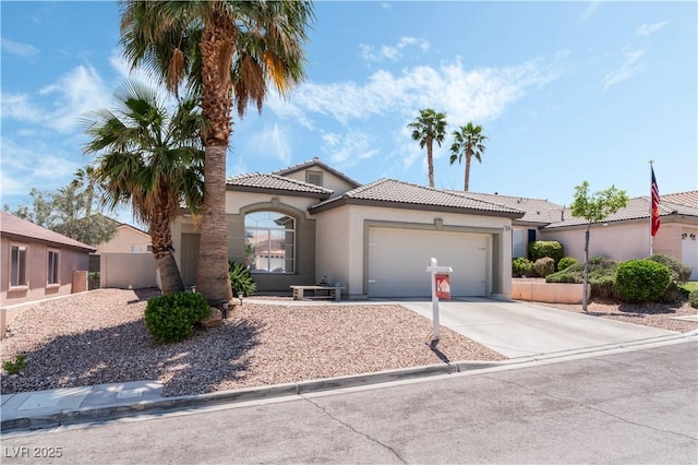 10701 Windrose Point Ave, Las Vegas, NV 89144 - view of front of house featuring stucco siding, a garage, driveway, and a tiled roof