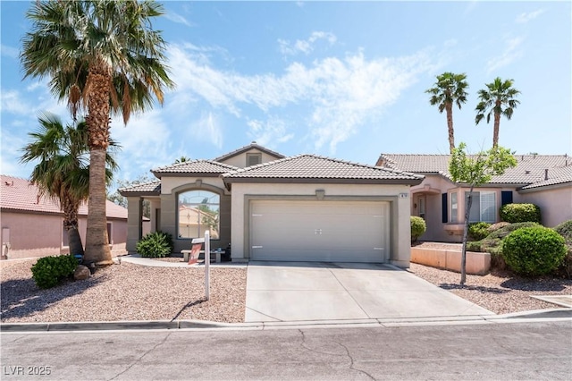 10701 Windrose Point Ave, Las Vegas, NV 89144 - mediterranean / spanish home with stucco siding, a tiled roof, a garage, and concrete driveway