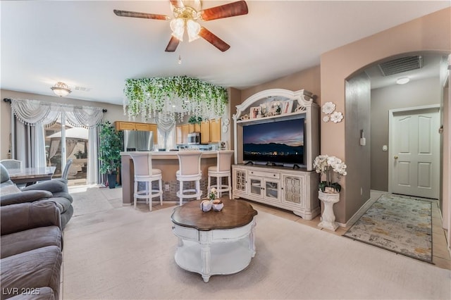 10701 Windrose Point Ave, Las Vegas, NV 89144 - living area with arched walkways and ceiling fan
