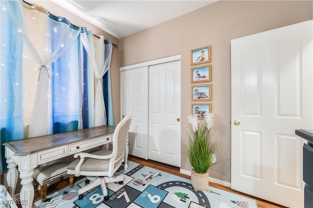 10701 Windrose Point Ave, Las Vegas, NV 89144 - home office with wood finished floors and baseboards