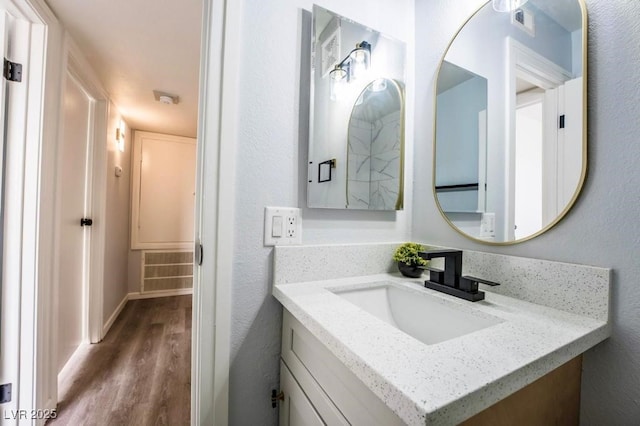 745 N Royal Crest Cir Unit 141, Las Vegas, NV 89169 - bathroom featuring wood finished floors and vanity