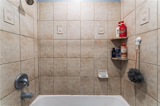 bathroom featuring washtub / shower combination