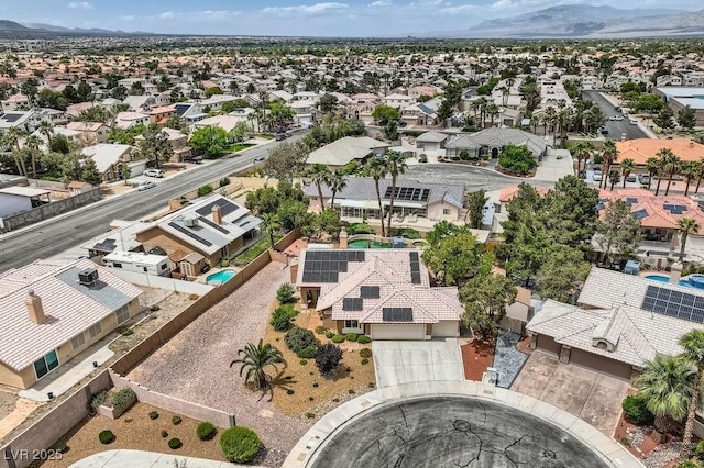 aerial perspective of suburban area featuring a mountain backdrop