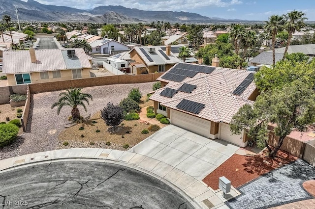 aerial view of residential area featuring a mountainous background