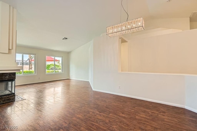 3619 Bixbee Ct, Las Vegas, NV 89129 - unfurnished living room featuring wood finished floors, baseboards, and a fireplace