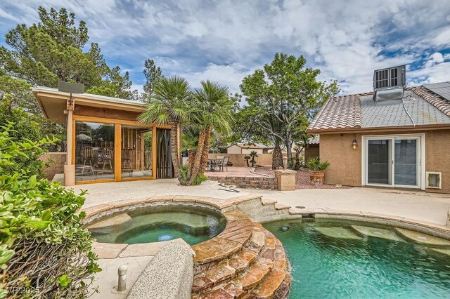 3619 Bixbee Ct, Las Vegas, NV 89129 - swimming pool with a patio and an in-ground hot tub