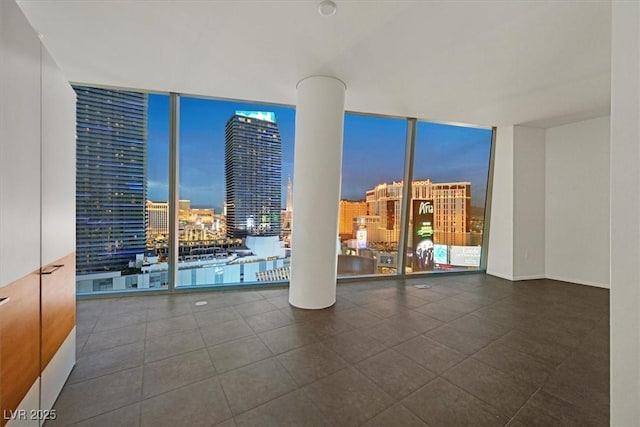 3726 Las Vegas Blvd Unit 1902, Las Vegas, NV 89158 - unfurnished room featuring a wall of windows and a view of city