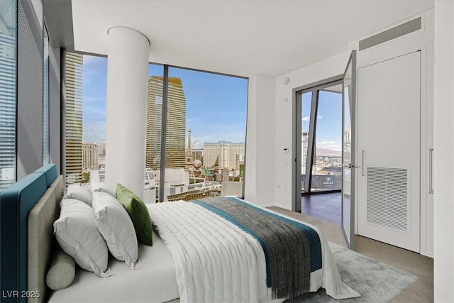 3726 Las Vegas Blvd Unit 1902, Las Vegas, NV 89158 - bedroom featuring access to outside, a wall of windows, and carpet