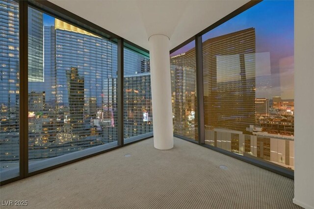 3726 Las Vegas Blvd Unit 1902, Las Vegas, NV 89158 - carpeted spare room featuring a city view and a wall of windows