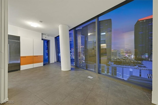 3726 Las Vegas Blvd Unit 1902, Las Vegas, NV 89158 - spare room with expansive windows and tile patterned floors